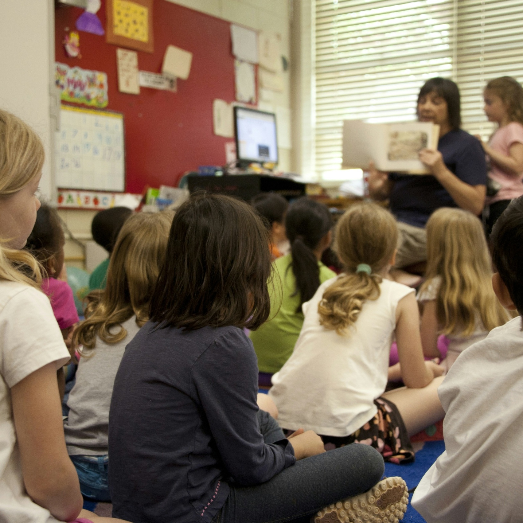 teacher reading to students